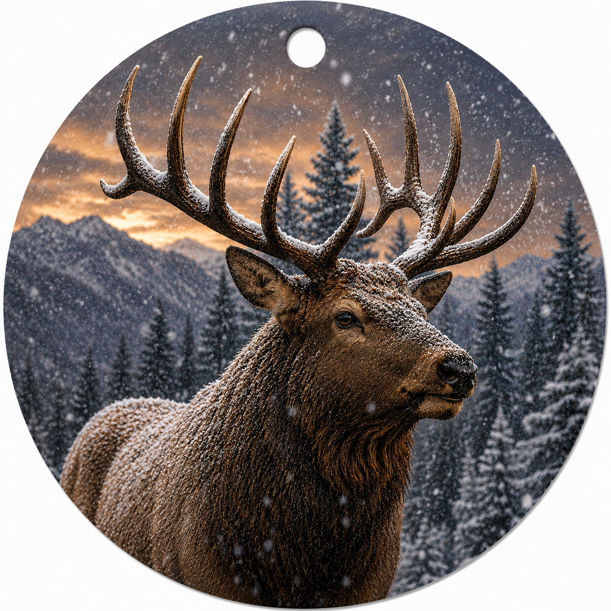 Round hanging ceramic ornament featuring a detailed winter forest scene with a large snow-dusted Bull Elk in the foreground, evergreen trees, mountains, and a snowy sky. The ornament has a circular shape with a hole at the top for hanging.